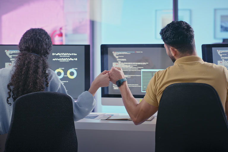 developers fist bumping